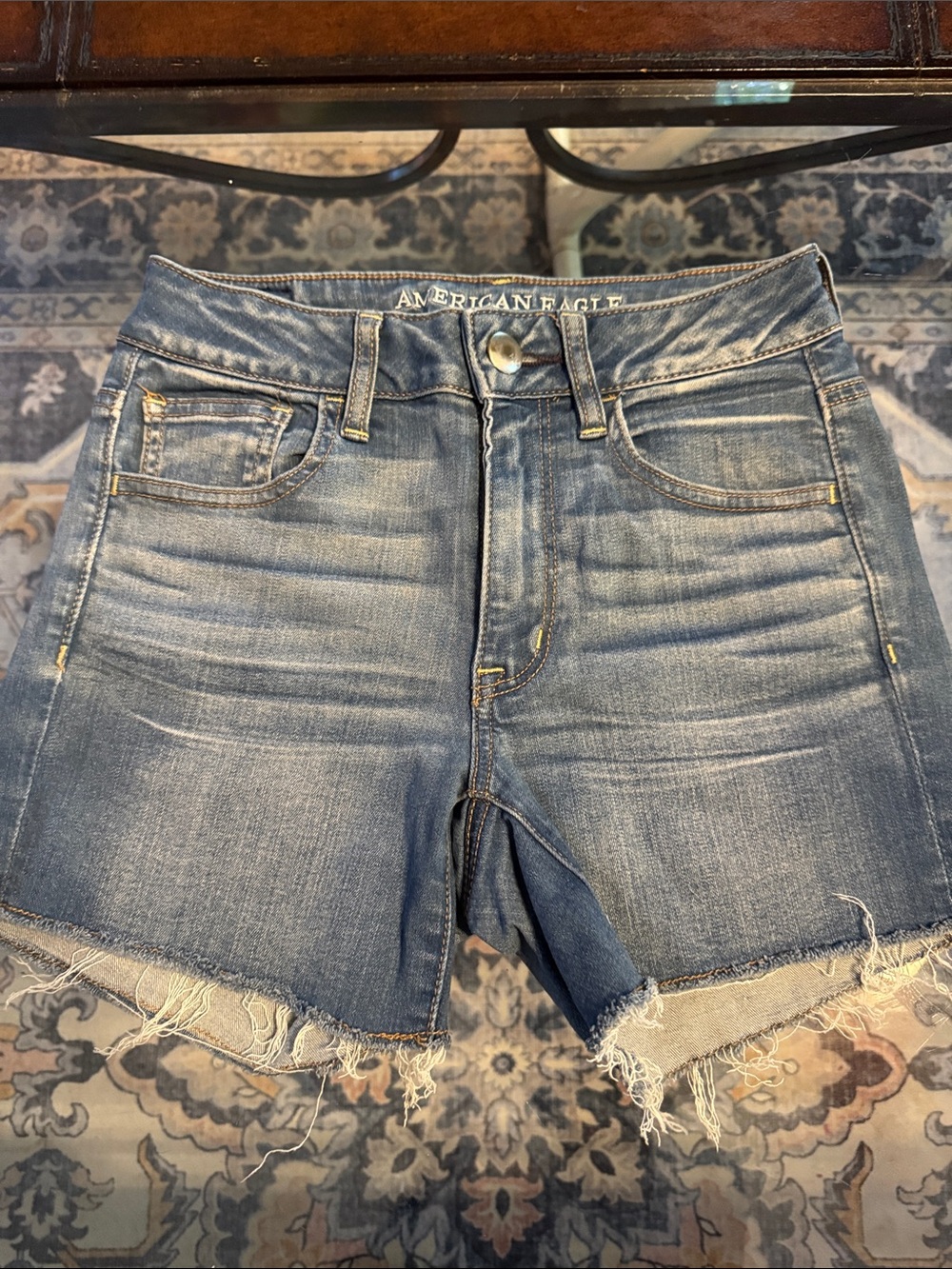 American Eagle Outfitters Faded Blue Mid-Rise Jean Shorts with Frayed Hem